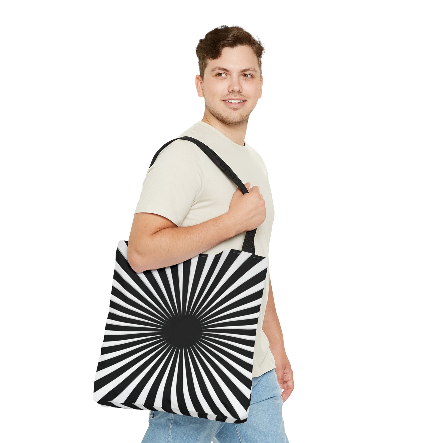 Man carrying a black and white hypnotizing stripe tote bag around his shoulder