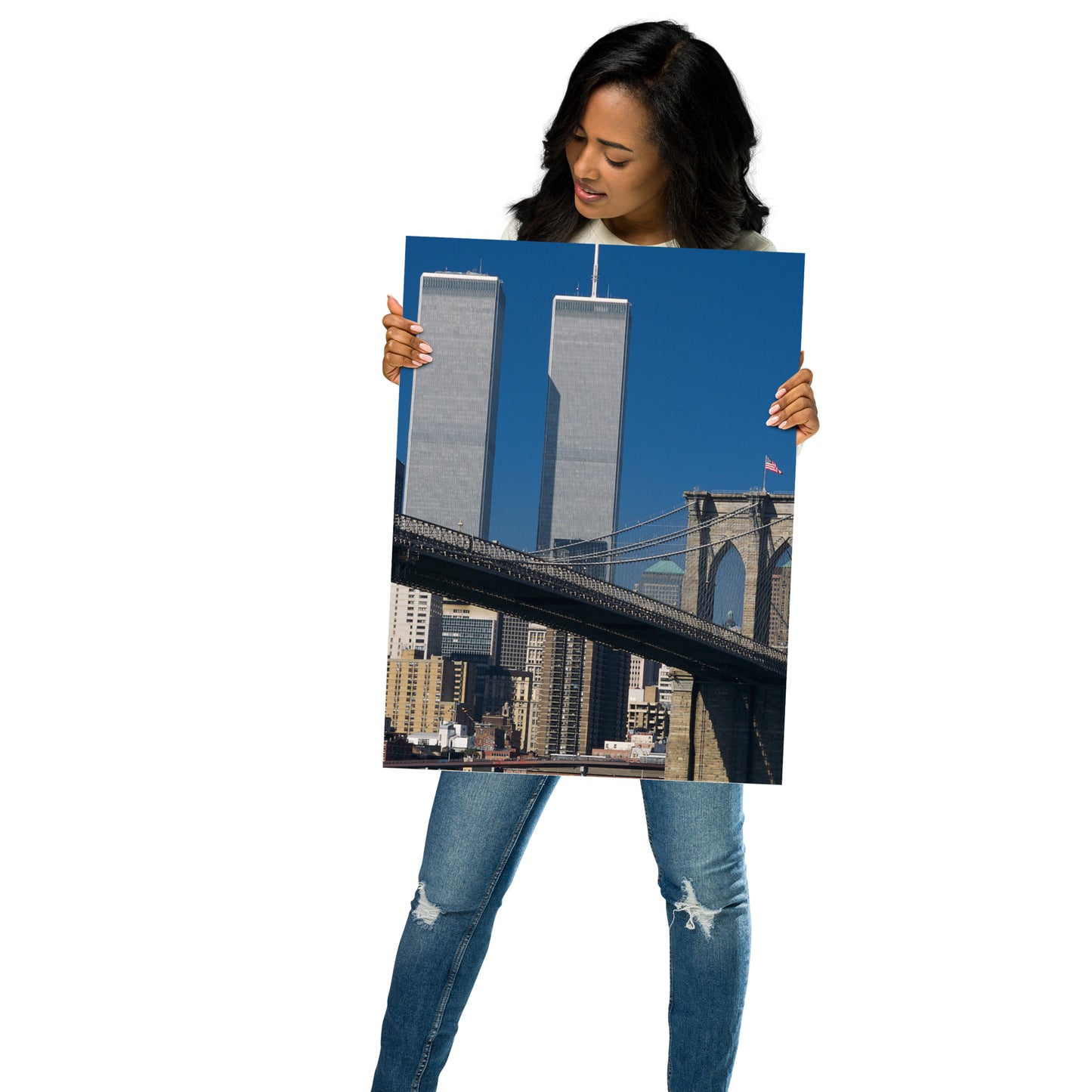 Woman holding an 18" x 24" poster of the World Trade Center Twin Towers and Brooklyn Bridge