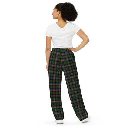 Woman wearing green plaid pants