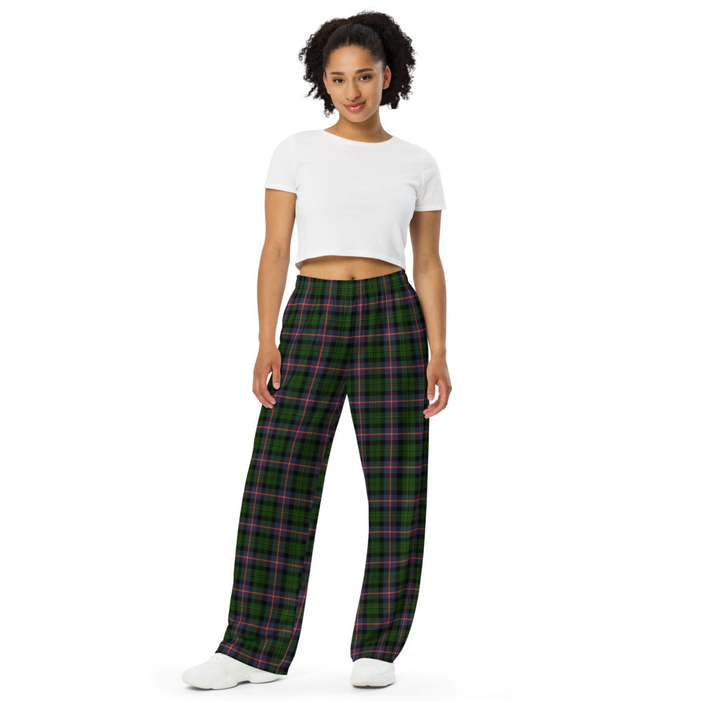 Woman wearing green plaid pants