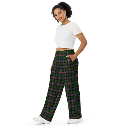 Woman wearing green plaid pants