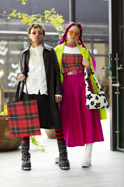 trendy couple holding a tartan plaid tote bag