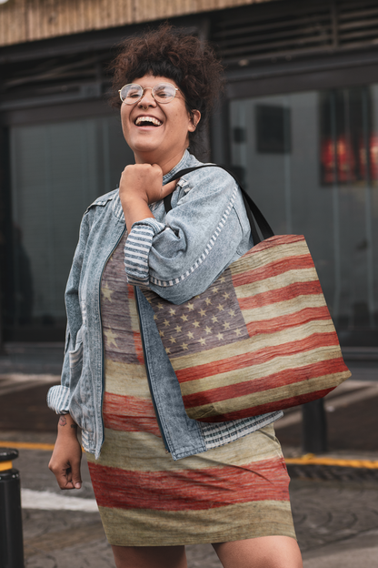 woman wearing an American flag print dress and carrying an American flag print tote bag