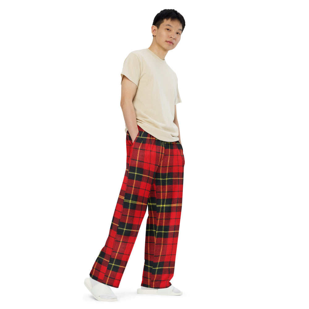 Man with hands in pockets wearing tartan plaid comfort pants