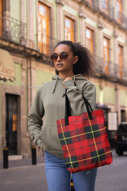 woman walking down a street holding a tartan plaid tote bag