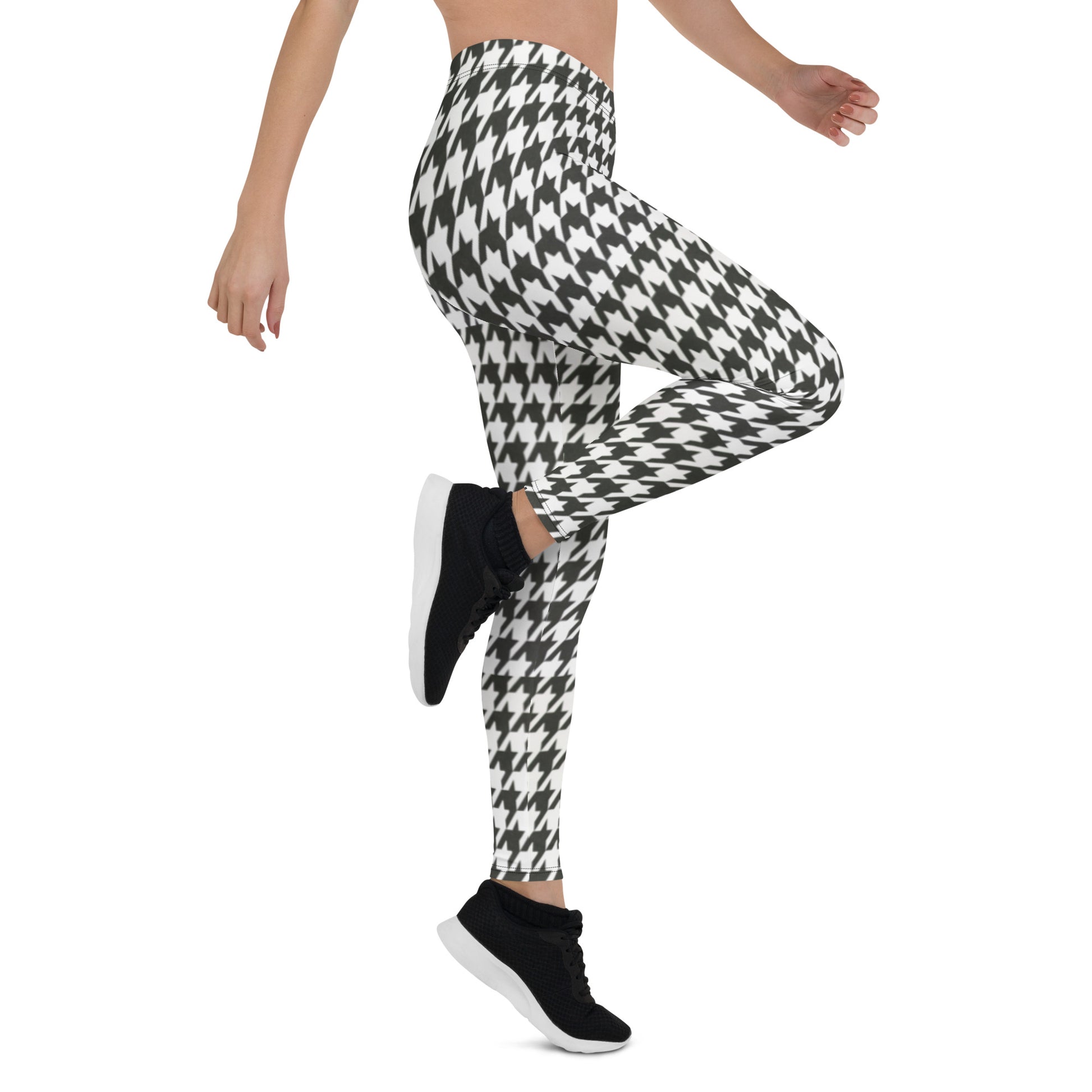 Waist down view of someone exercising and wearing houndstooth yoga pants 