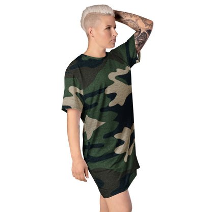 Woman posing with one arm over her head wearing a camouflage print t-shirt dress